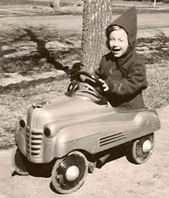 Young Dennis and his pedal car