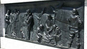 One of the 24 bronze bas reliefs that flank the ceremonial entrance