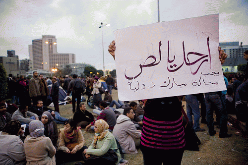 A protester carrying a banner: 