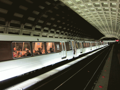 A DC Metro subway train arrives at a station carrying passengers, From ImagesAttr