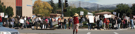 A portion of the crowd stood in front of the Bank of America.