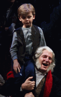 Tiny Tim (Colin Wilson) with the transformed Scrooge (det.)