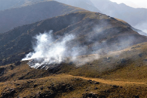 Smoking ruins of a Pakistan Army outpost attacked by US copters. 24 died.