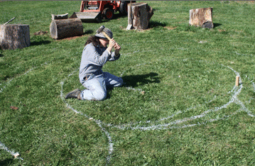 Mary Shapiro works on the Divine Masculine labyrinth.