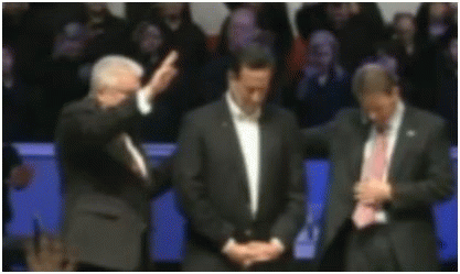Rick Santorum praying and being prayed over.