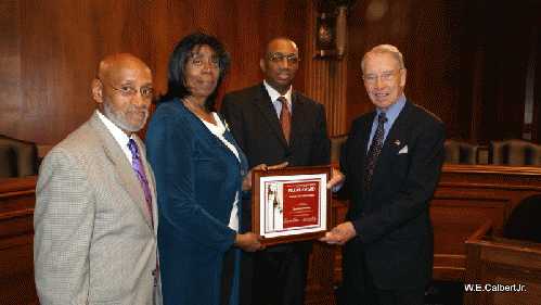 Lawrence Lucas, Marcel Reid, Michael McCray present Pillar Human Rights Award to