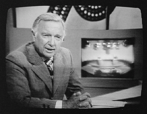 English: American broadcast journalist Walter Cronkite (b. 1916) on television d