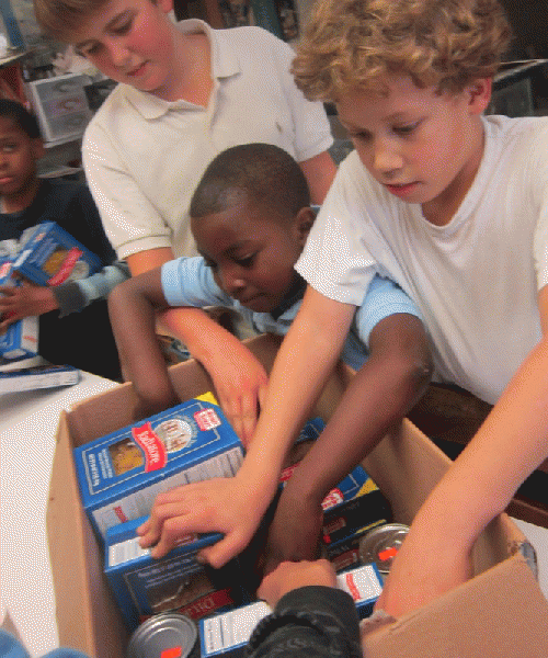 Greenhouse School kids pack up supplies.