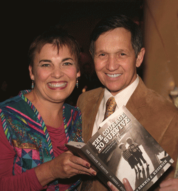 Dennis Kucinich signs his book, Courage to Survive, for Meryl Ann Butler