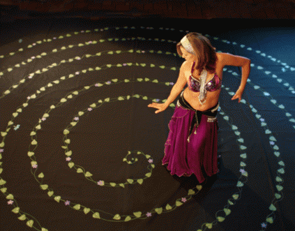 Debi Kermeen dancing the Nature-Inspired painted canvas labyrinth