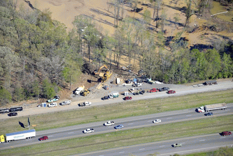 Big manly equipment is dwarfed by the magnitude of the spill ...