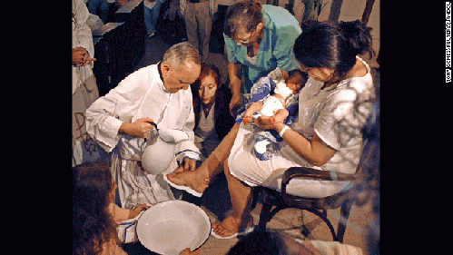 Francis I washing women's feet on Holy Thursday