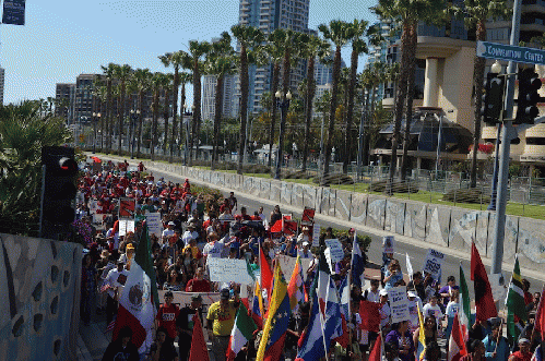 Marchers go by the San Diego Convention Center, From ImagesAttr