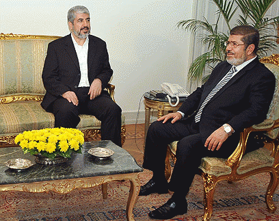 Ousted Egyptian President Mursi and Hamas chief Mishaal, From ImagesAttr