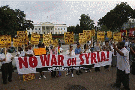The ''Act now to stop war and end racism'' (ANSWER) coalition holds a rally outside the White House in Washington, August 29, 2013. The group rallied their opposition to U.S.-led military action on Syria., From ImagesAttr