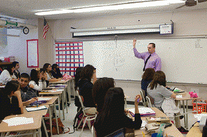 First year teacher, teaching a lesson in a High School classroom.