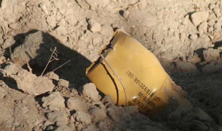 Unexploded US cluster bomb in Afghanistan waits for child (, From ImagesAttr