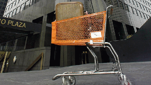 The belongings of a homeless man stand in a cart , From ImagesAttr