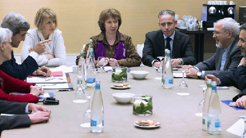 U.S. Secretary of State John Kerry (2nd L), European Union foreign policy chief Catherine Ashton (C ) and Iranian Foreign Minister Mohammad Javad Zarif (2ndR) wait prior to a meeting on November 9, 2013, on the third day of talks on Iran's nuclear program, From ImagesAttr