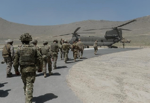 NATO soldiers board a Chinook helicopter last June. The alliance said that six service members died on Tuesday, after a helicopter crashed in southern Afghanistan.  Read more: nydailynews.com/news/world/6-american-troops-killed-crash-afghanista, From ImagesAttr