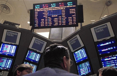 Traders gather at the Goldman Sachs post on the floor of the New York Stock Exchange, January 18, 2012., From ImagesAttr