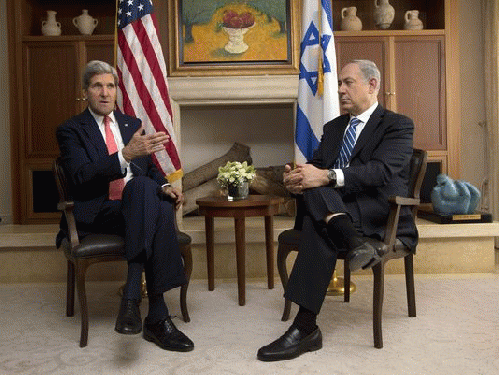 Israeli Prime Minister Benjamin Netanyahu, right, listens to Secretary of State John Kerry during a meeting on Nov. 6, 2013, in Jerusalem., From ImagesAttr