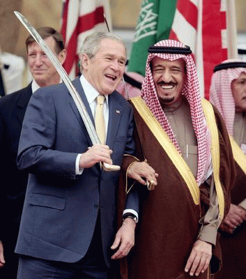 U.S. President George W. Bush (L) and Saudi Arabia's Prince Salman Bin Abdul Aziz, brother of King Abdullah, watch a traditional celebration dance outside the Al Murabba Palace in Riyadh, Saudi Arabia, January 15, 2008.