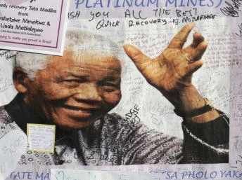 A poster of Nelson Mandela is filled with get well messages outside the Medi-Clinic Heart Hospital in Pretoria, 3 July, 2013 , From ImagesAttr