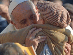Pope Francis kisses a child as he arrives for his general audience at St Peterâ€™s square on December 11, 2013 at the Vatican, From ImagesAttr