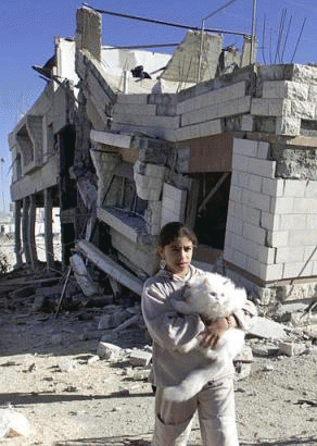 Sumayya and her cat in front of her demolished home 2002, 2nd Intifada, From ImagesAttr