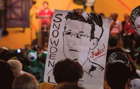 Activists take part in a demonstration asking Brazilian president Dilma Rousseff to grant Edward Snowden asylum on Dec 19, 2013, From ImagesAttr
