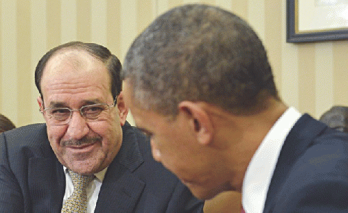 Iraqi PM Nouri (or Jawad) Al-Maliki meets US President Barak Obama in D.C. in November 2013, From ImagesAttr