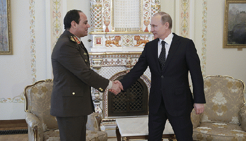 Russian President Vladimir Putin shakes hands with Egypt's Army chief Field Marshal Abdel Fattah al-Sisi during their meeting at the Novo-Ogaryovo state residence outside Moscow, Feb. 13, 2014