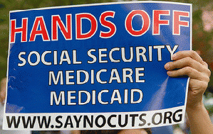 Sign at Occupy St Pete: .Hands Off Social Security, Medicaid Medicare.  .SayNoCuts.org., From ImagesAttr