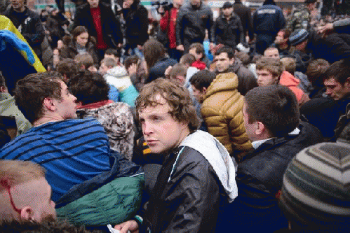 Pro-Western demonstrators sit after being overpowered by pro-Russia demonstrators after clashes at the local administration building in the northeastern city of Kharkiv, Ukraine, Saturday, March 1, 2014., From ImagesAttr