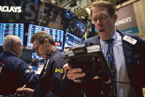 Traders work on the floor of the New York Stock Exchange April 7, 2014., From Images