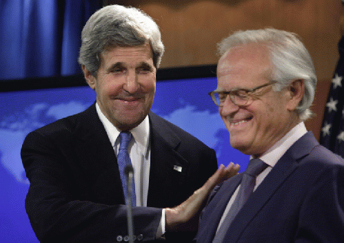 U.S. Secretary of State John Kerry (left) greets the new US peace envoy Martin Indyk at the State Department, From ImagesAttr