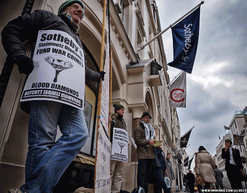 Human rights activists protest outside Sotheby's New Bond Street outlet in London, March 2013