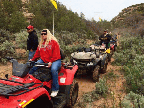 ATV riders pause near Indian ruins on as closed portion of the Recapture Canyon trail, From ImagesAttr