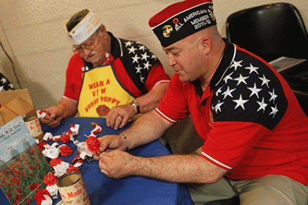 Joseph Hatfield, â€œPoppa Joe,â€ and Brian Scarbrough prepare poppies at the Piney Green VFW in Jacksonville., From ImagesAttr