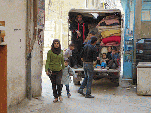 Another family fleeing the violence in Syria and trying to make a temporary home in one of Lebanon's Palestinian refugee camps, From ImagesAttr