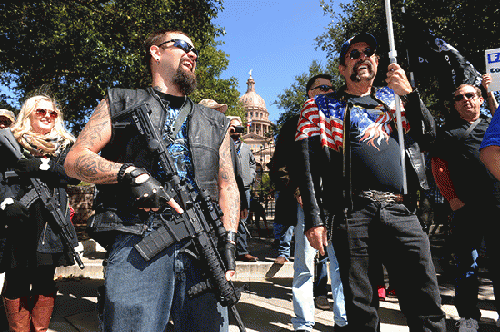Armed open carry advocates gather in front of the Capitol during South by Southwest. Armed open carry advocates gather in front of the Capitol during South by Southwest.