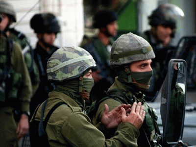 Israeli soldiers patrol in the search for three Jewish settlers in Hebron., From ImagesAttr