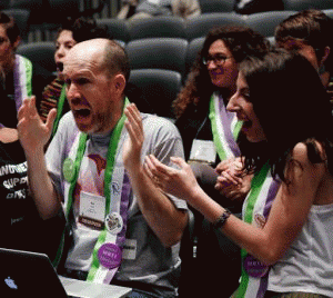 Observer Robert Ross, reacting  as the final divestment victory vote is posted