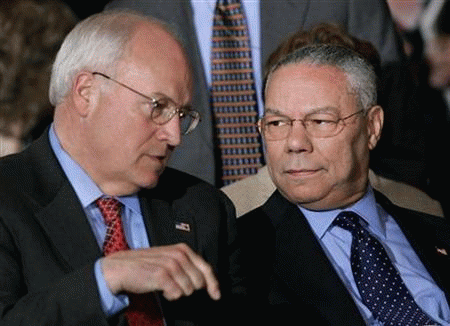 Then Secretary of State Colin Powell is pictured in this November 12, 2004 file photo talking to then Vice President Dick Cheney during a joint press conference.