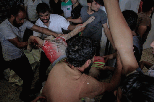 GAZA, PALESTINE - 2014/07/20: Palestinian medics carry the body of a child killed in Shijaiyah east of Gaza City, after Israel expanded its ground offensive on the Gaza Strip, From ImagesAttr