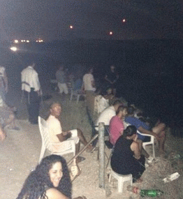 Israelis on chairs with popcorn cheer the leveling of Gaza (