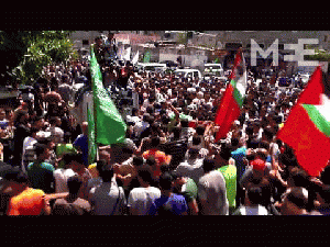 Thousands mourn slain wife, baby of Hamas's military chief Mohammed Deif., From ImagesAttr