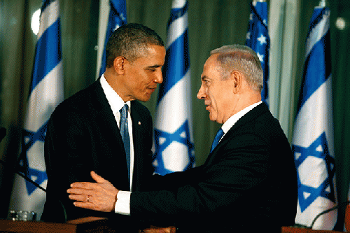U.S. President Barack Obama (L) greets Israeli Prime Minister Benjamin Netanyahu during a press conference on March 20, 2013 in Jerusalem, Israel., From ImagesAttr