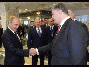 Russia's Putin, Ukraine's Poroshenko Shake Hands At Minsk Talks